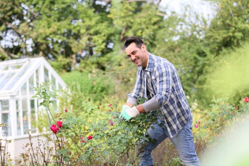 Expert laying turf in a well-prepared garden