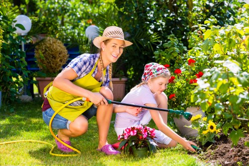 Satisfied customers enjoying their newly installed artificial lawn